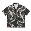 Short sleeve Cuban collar shirt with snake bone and floral pattern in a colour block style.