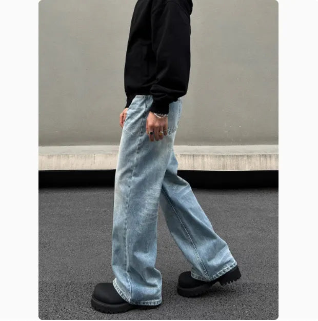 Men's blue straight jeans with whisker washing on thighs and flared leg design