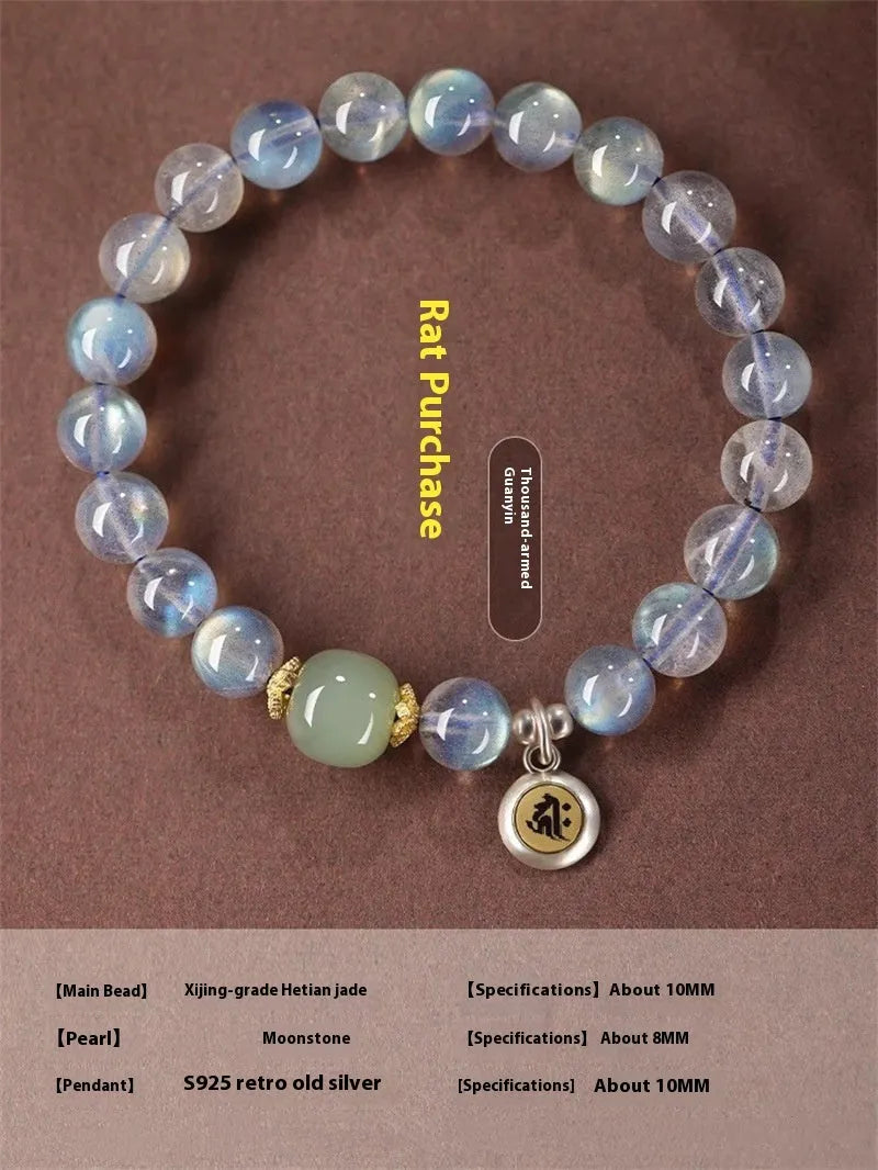 Moonstone bracelet with 8mm beads and a silver Guanyin mouse zodiac charm on a black background.