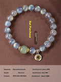 Moonstone bracelet with 8mm beads and a silver Guanyin mouse zodiac charm on a black background.