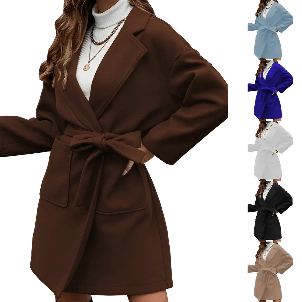 Minimalist long sleeve lapel button coat with a split belt in a loose fit, shown in a choice of colours.