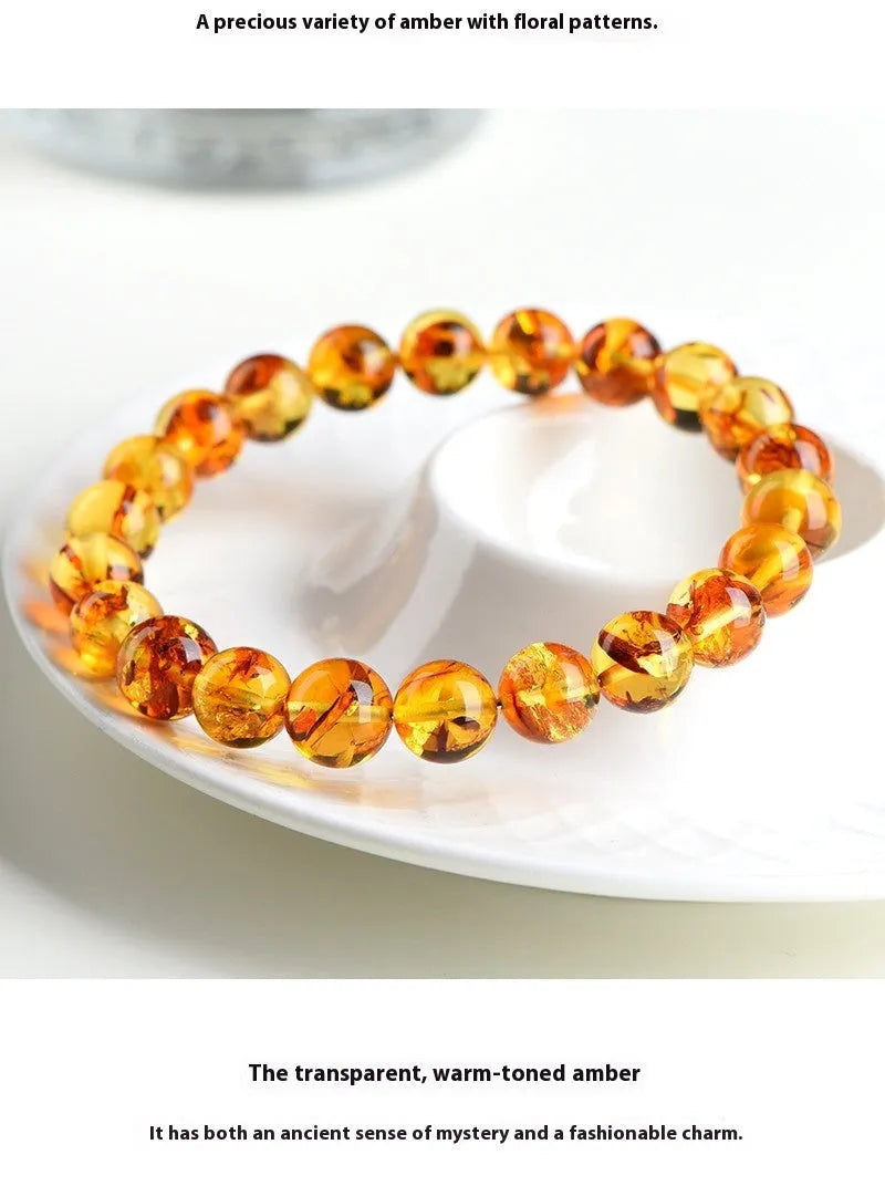 Natural yellow piebald amber bracelet with geometric polished beads.