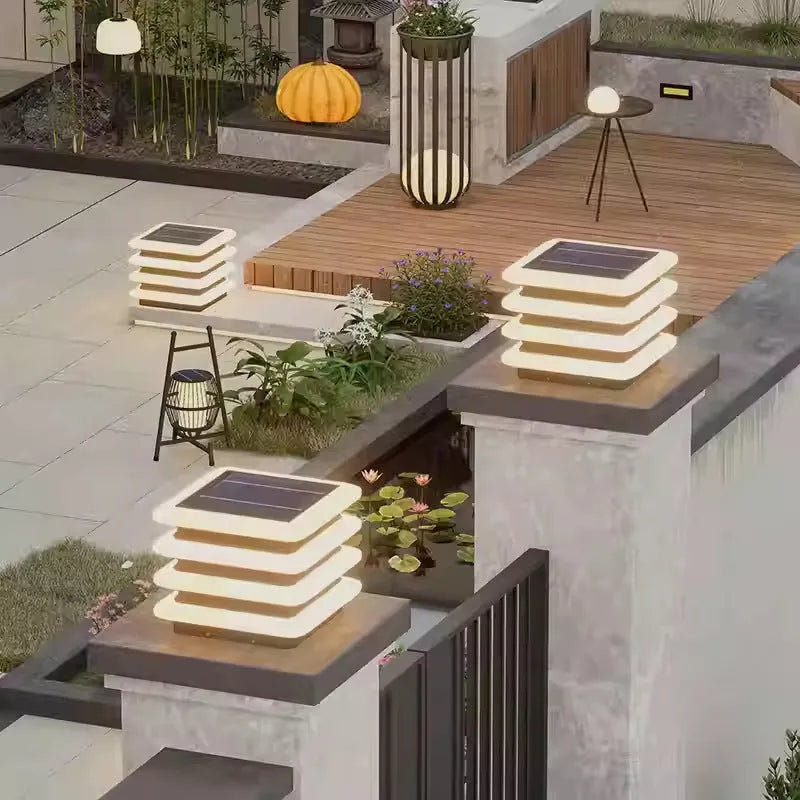Square stainless steel solar pillar lamp on a garden wall, IP65 waterproof, available in 30cm and 40cm heights