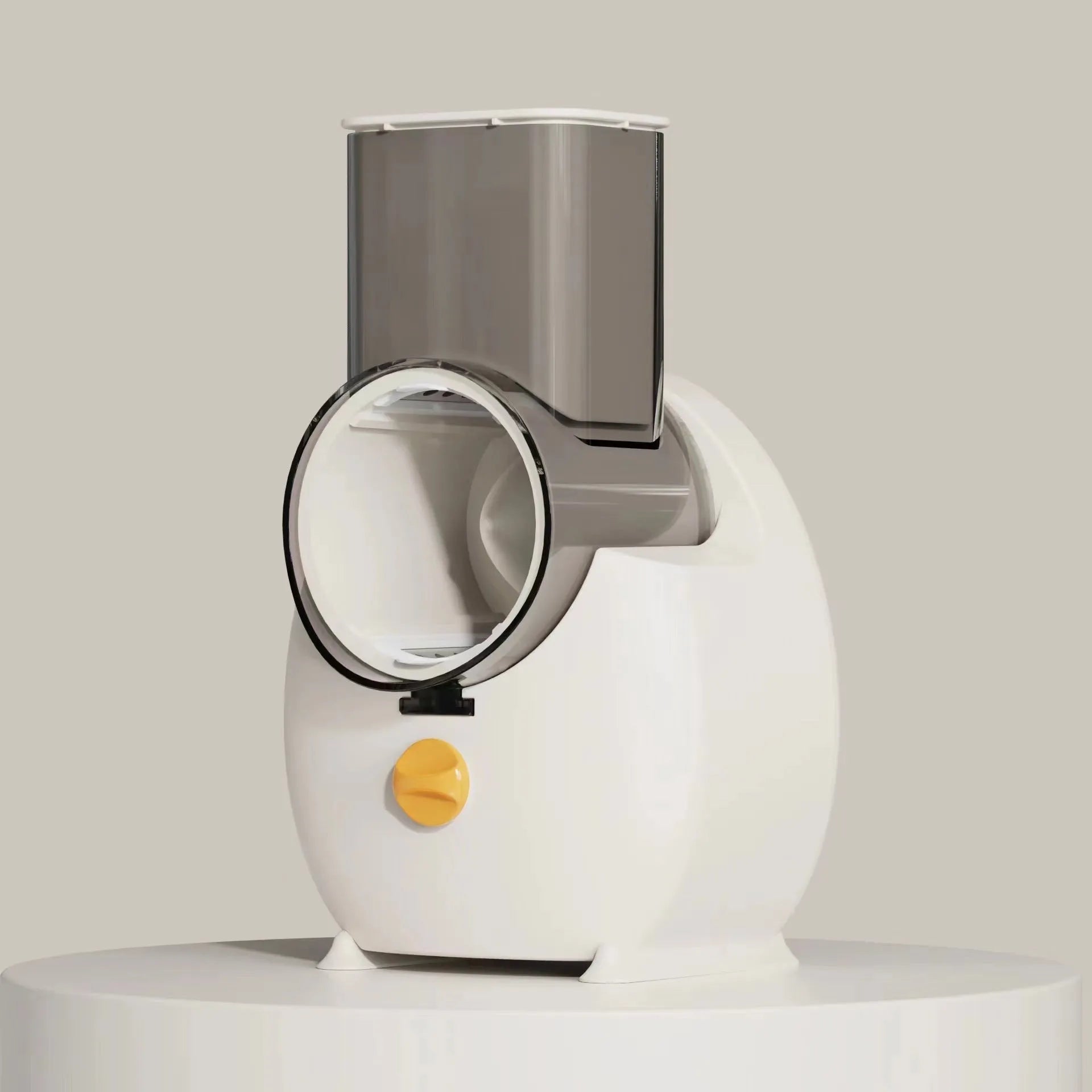 White electric rotary vegetable slicer with suction base and interchangeable blades on a kitchen counter.