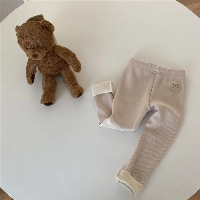 Girls' high-waist fleece-lined winter leggings in beige, black, brown, and grey with a hair band belt.