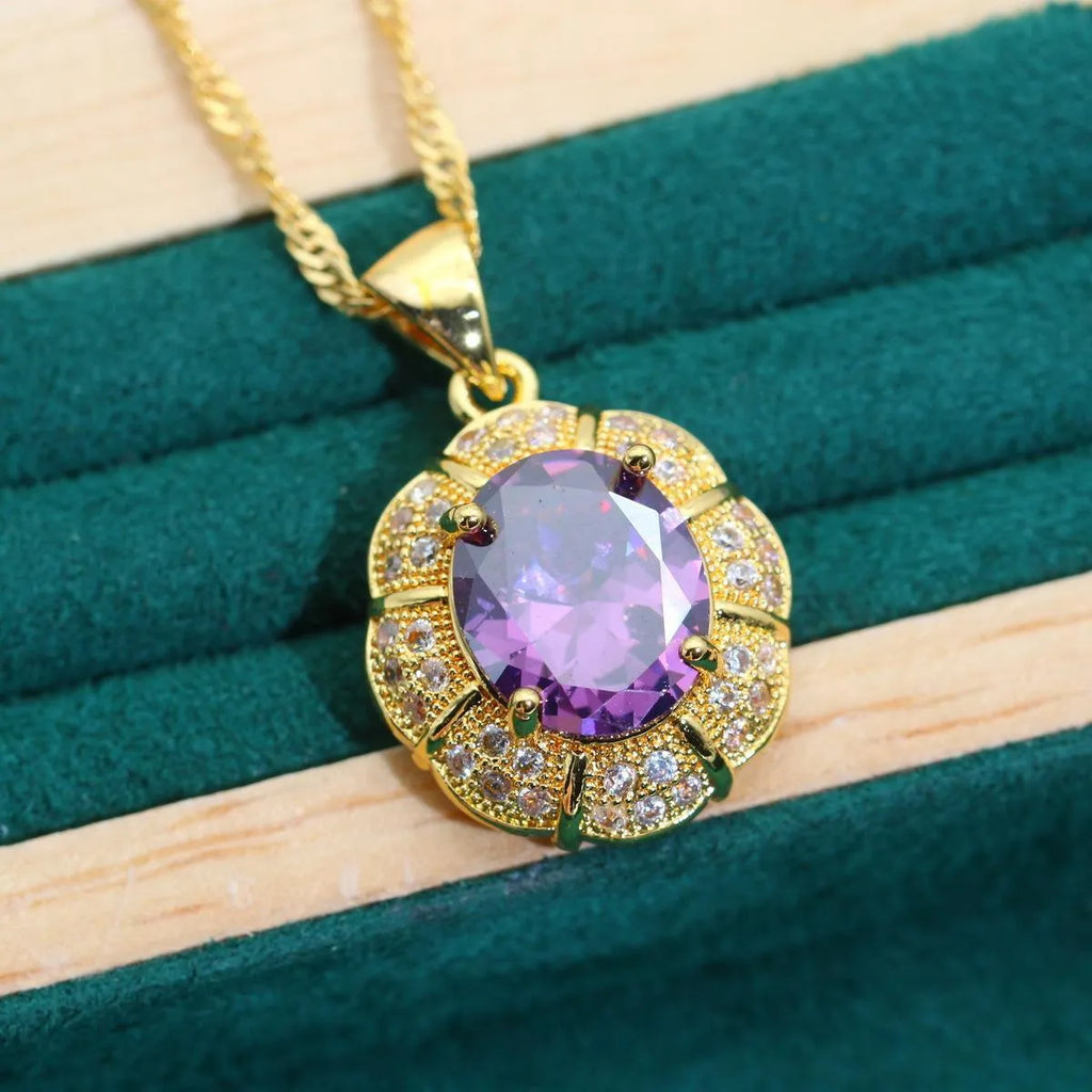 18k gold-plated necklace, earrings, ring, and bracelet set with colourful Raytheon-cut cubic zirconia stones.