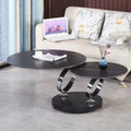 Round rotary folding table with slate top in black and white, set in a living room