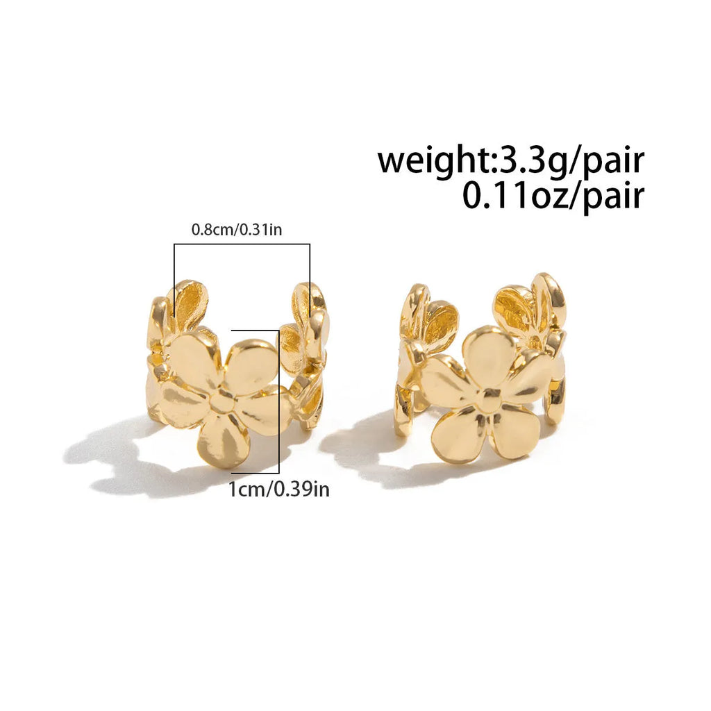Gold-coloured starfish and scallop shell women's alloy earrings on a white background.
