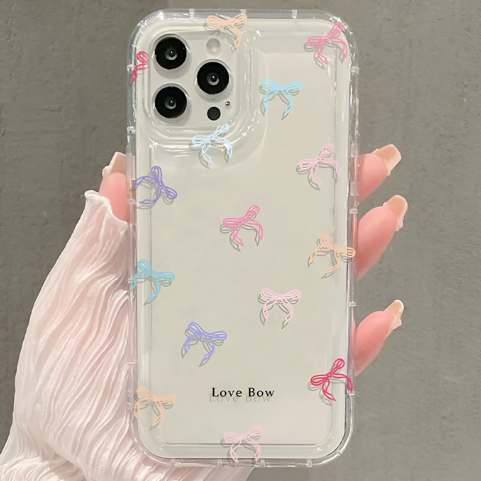 Transparent silicone phone case with bow design and airbag corners for iPhone drop protection