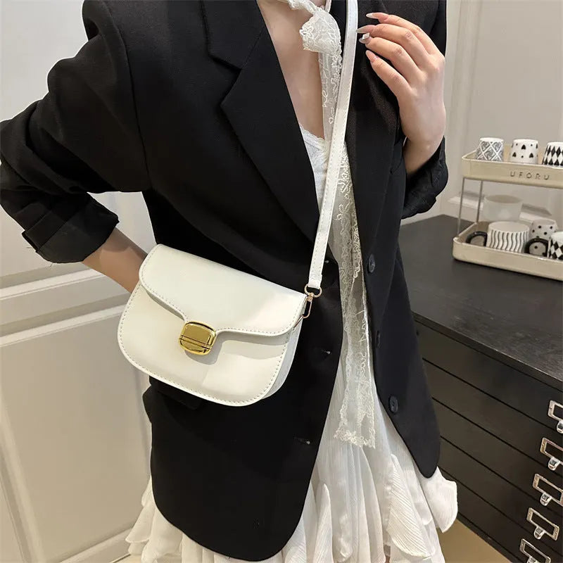 Simple PU handbag for women in one of six colours, showing interior with zippered change purse and phone pocket.