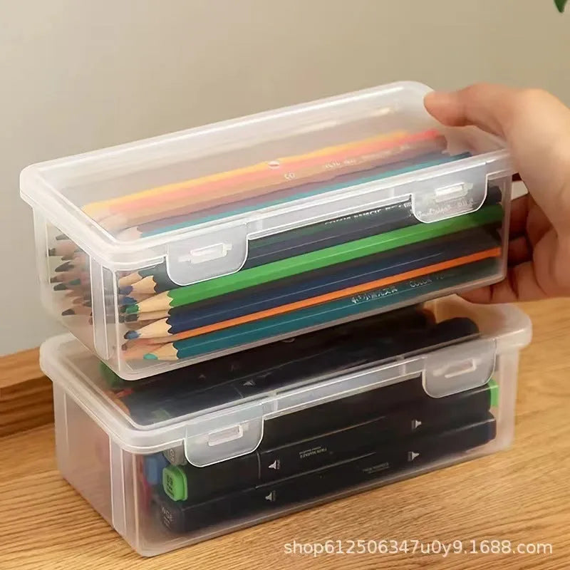 Large transparent pencil storage box with compartments for organising coloured pencils and drawing materials
