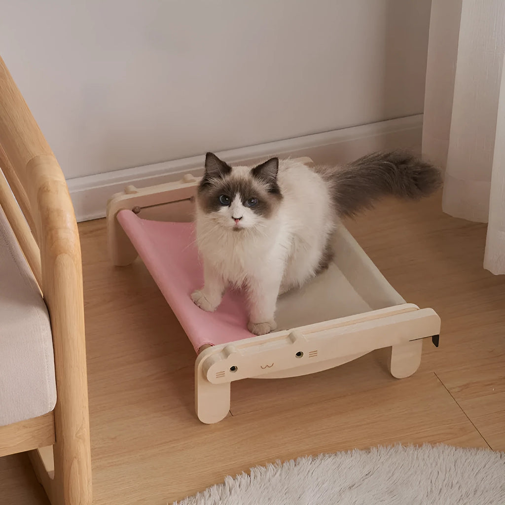 Solid wood cat bed with removable fabric in black and white plaid pattern