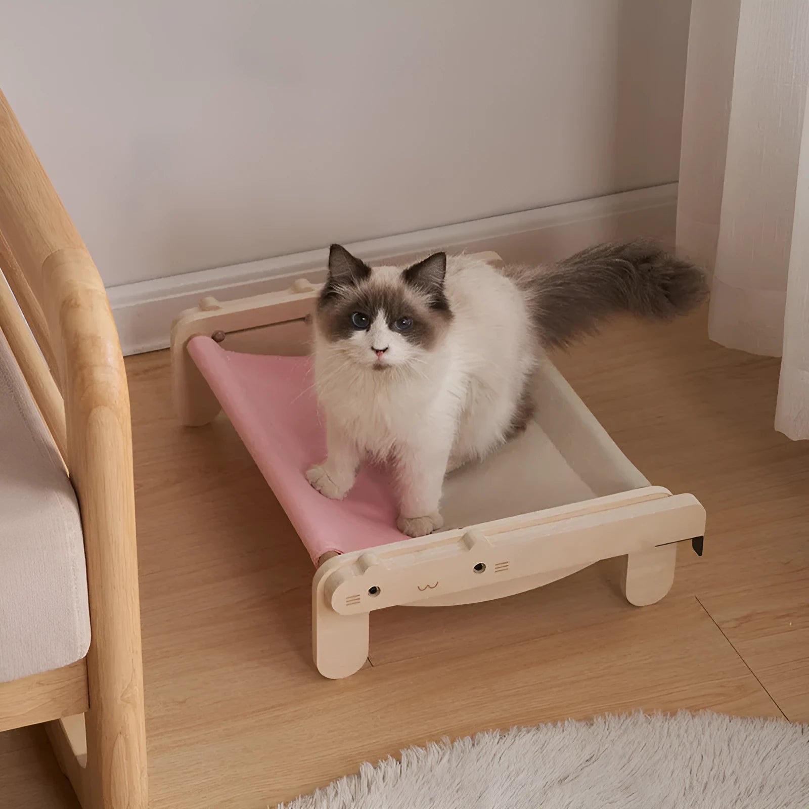 Solid wood cat bed with removable fabric in black and white plaid pattern