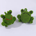 Handmade green plush frog car pendant hanging, showing woven cord and cartoon style.