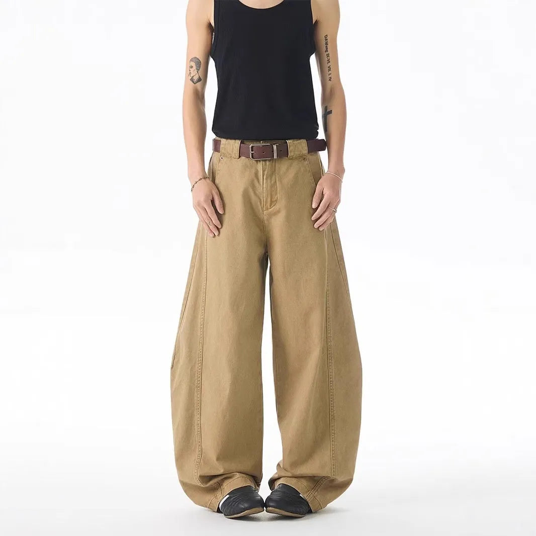 Men's brown loose-fit straight-leg casual jeans with a button fly on a mid waist.