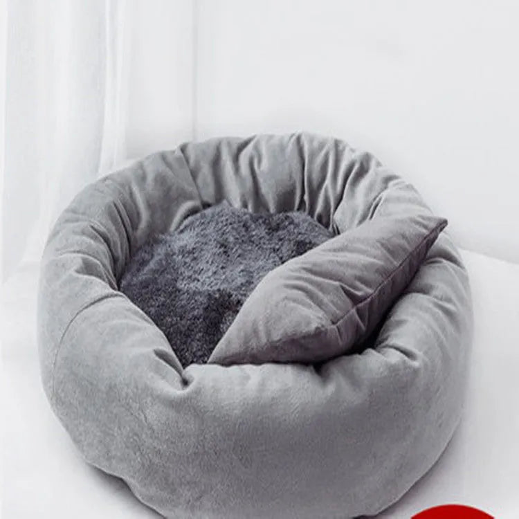 Light grey cotton-filled dog bed for a medium-sized dog with a matching pillow.
