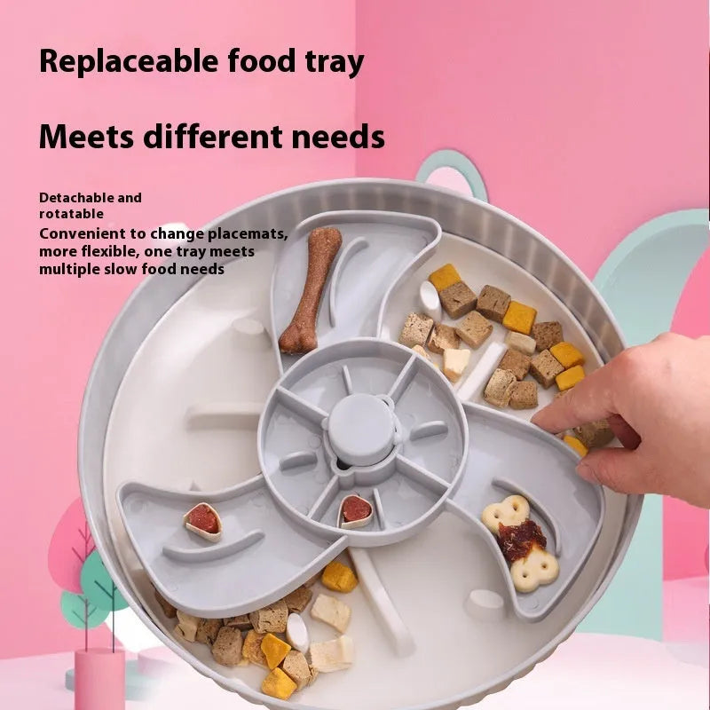 Grey slow feed dog bowl with rotating puzzle disc and a textured, green silicone licking mat in the centre