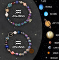 Adjustable natural stone beaded bracelet with twelve zodiac signs on a cord with sliding knot.
