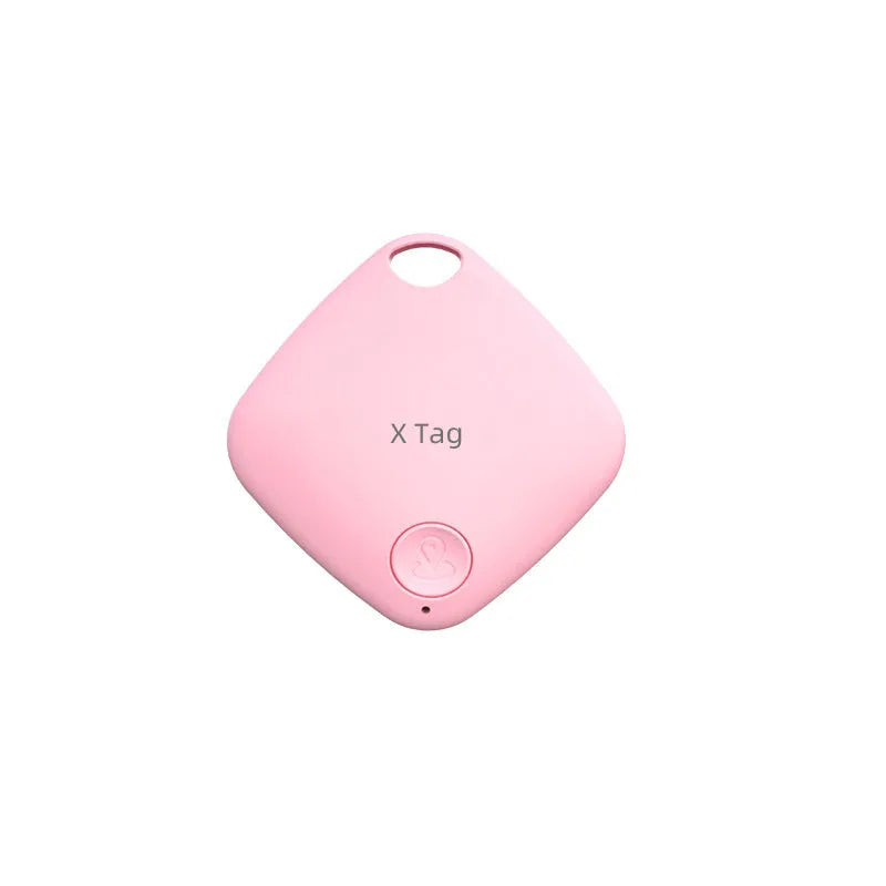 Small black Bluetooth key finder tracker on a keyring next to a smartphone showing location app.