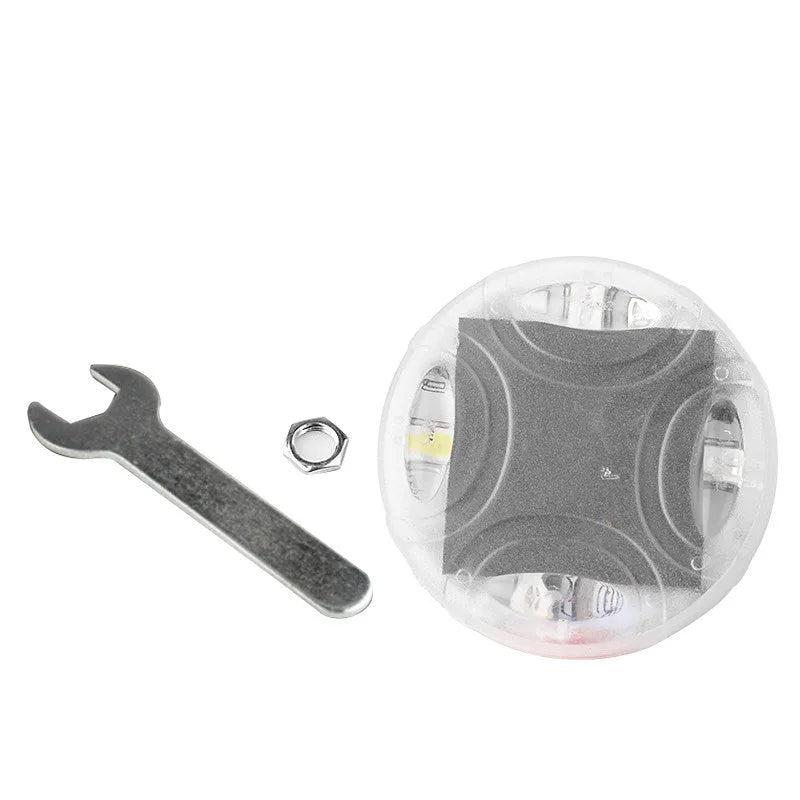 Colourful solar-powered LED valve light for mounting on a vehicle wheel hub.