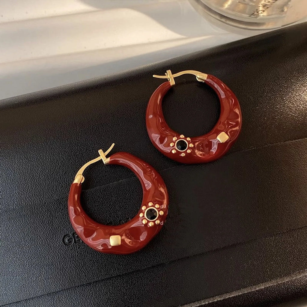 Hong Kong style retro ear studs with rhinestone inlay and dripping oil texture in black and red colours