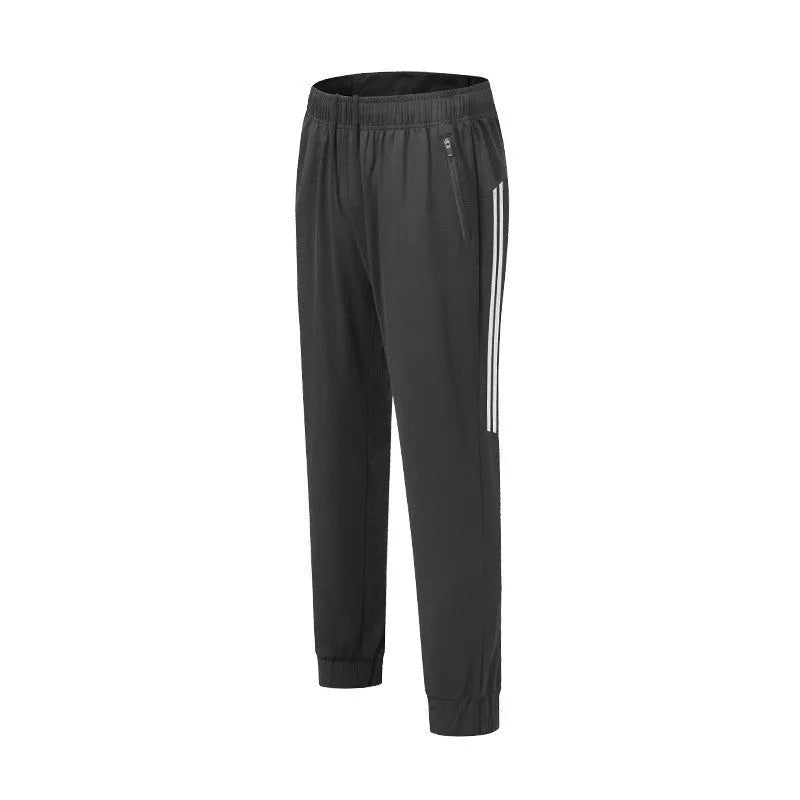 Men's black and navy blue polyester sports trousers for running and exercise with a mid-waist fit.