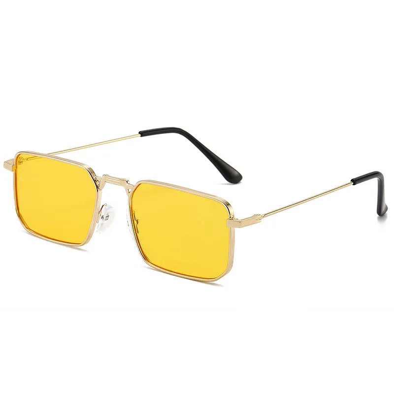 Square-shaped steampunk sunglasses for men with gold frame and grey lenses on a plain background