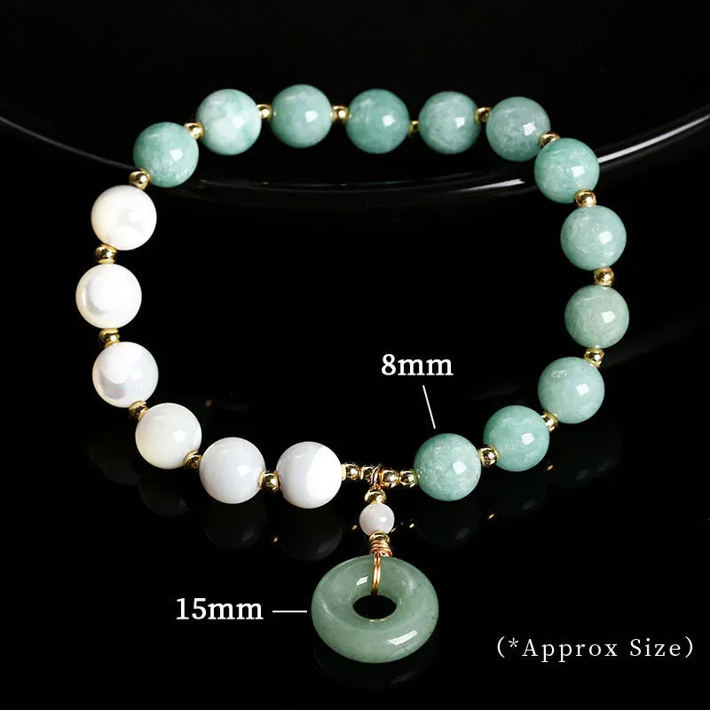 Women's Burma jade bracelet with copper horseshoe screw safety clasp showing 8mm round beads