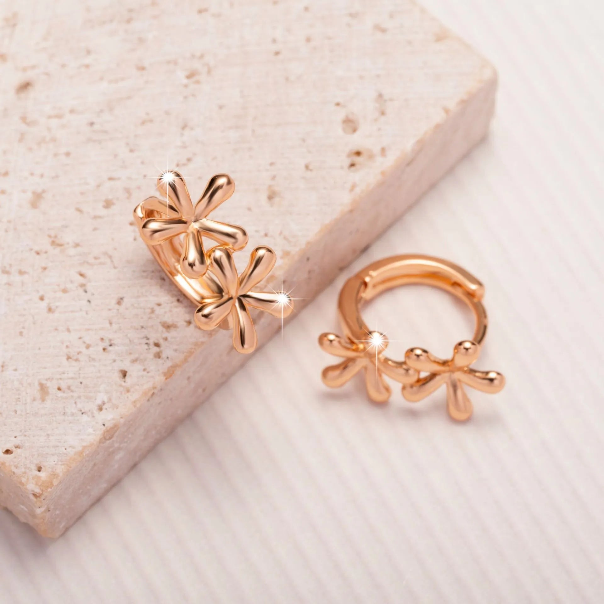Rose gold electroplated waterdrop flower earrings with circular 20mm floral design on a white background.