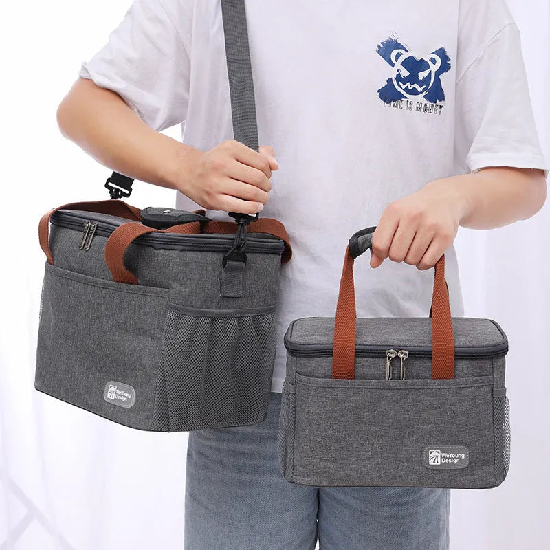 Grey insulated crossbody picnic bag with shoulder strap and 15 litre capacity.