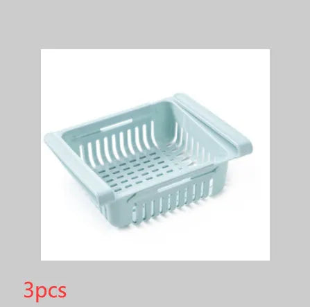 Blue telescopic plastic storage basket for refrigerator organisation with fruits and vegetables inside.