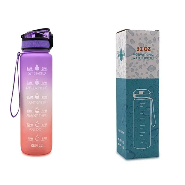 Blue and red gradient 1-litre Tritan sports water bottle with time markers, flip-top lid, and wrist strap.