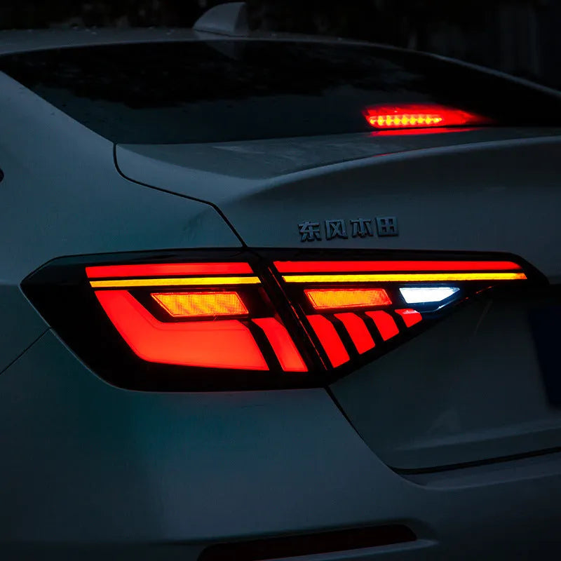 Black and red modified LED taillight assembly for 11th Generation Honda Civic with streamer lights.