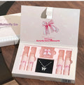 Butterfly Box makeup set showing pink lip mud, powder blusher, and necklace