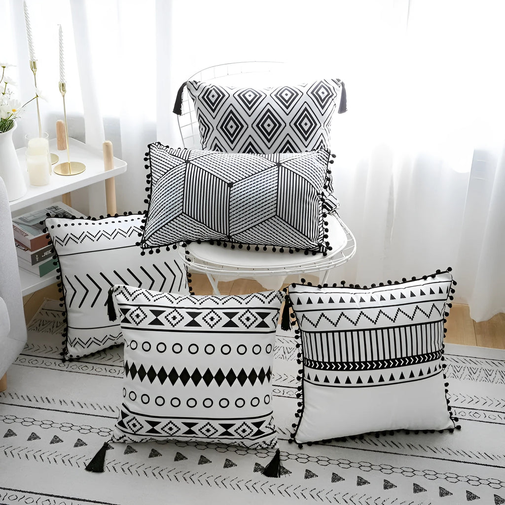 Bohemian national style polyester cushion cover in light grey on a sofa.