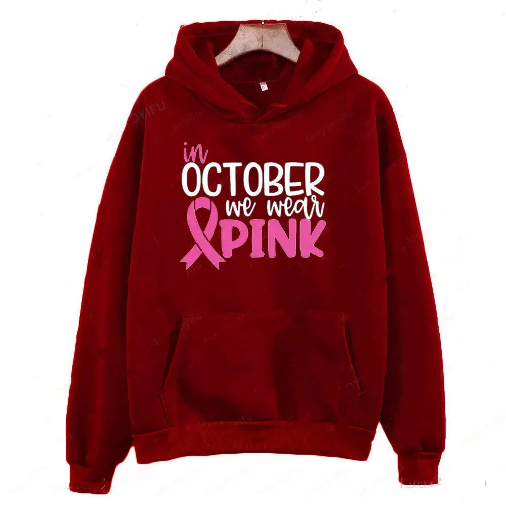 I'm A Survivor retro graphic hoodie in pink colour with side seam pockets, showing long-sleeve pullover design.