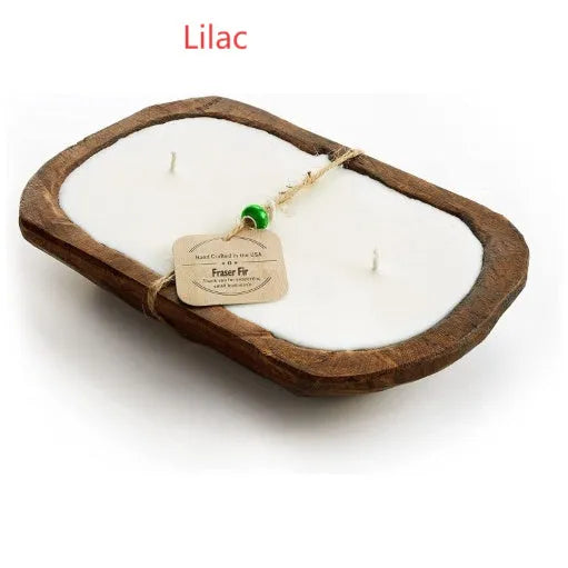 Retro wooden basin containing a lavender-coloured soy wax candle with three visible wicks.