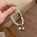 White multi-layer beaded bracelet with rice-shaped beads in geometric ethnic design
