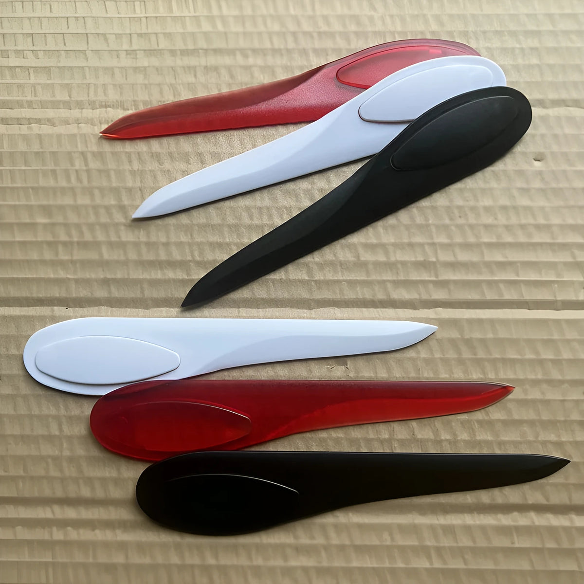 Willow Leaf Art A4 plastic paper cutter with colourful handle on white background