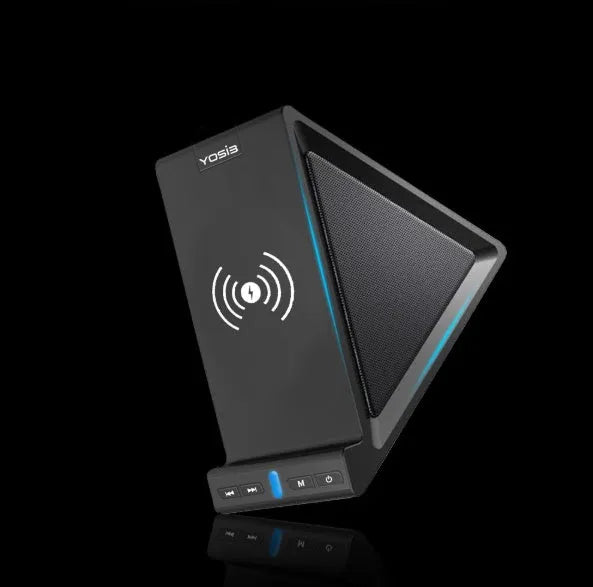Black multifunctional Bluetooth speaker with integrated phone stand and wireless charging pad on top.