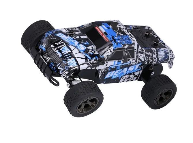 Blue 1:18 scale remote control off-road drift car with 2.4Ghz transmitter on a flat surface.
