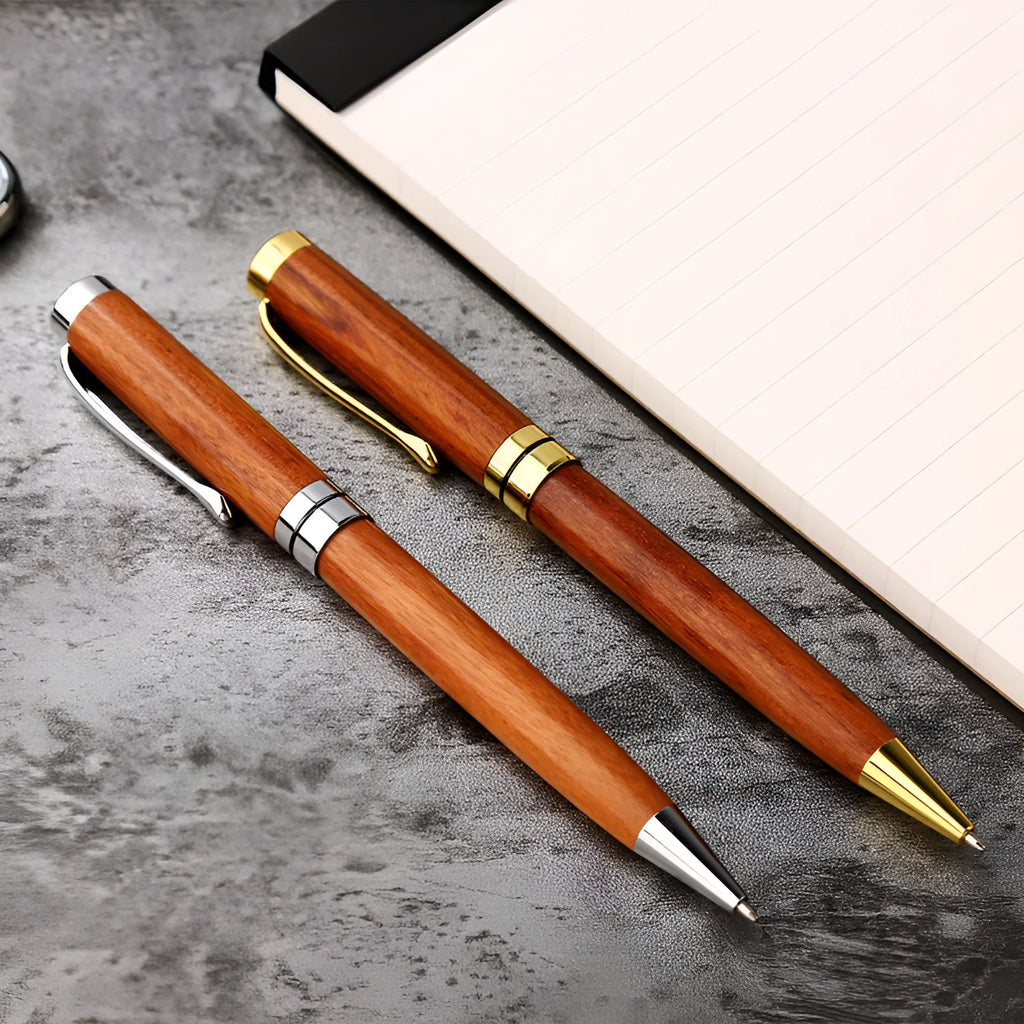 Gold metal and rosewood ballpoint pen 14cm long with cap