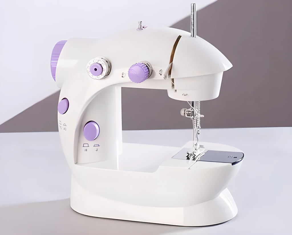 Small white plastic electric sewing machine with thread cutter and light on a table