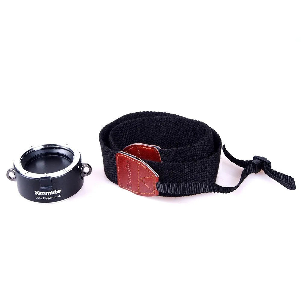 Aluminium camera lens flipper holder with cotton shoulder strap for quick lens changes on Nikon, Canon, or Sony cameras.
