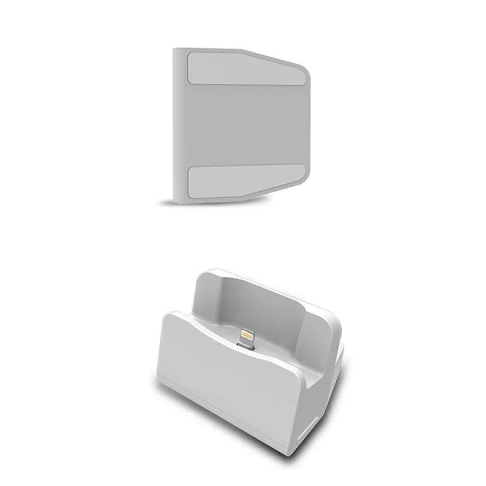 White minimalist headphone charging base on a desk or table