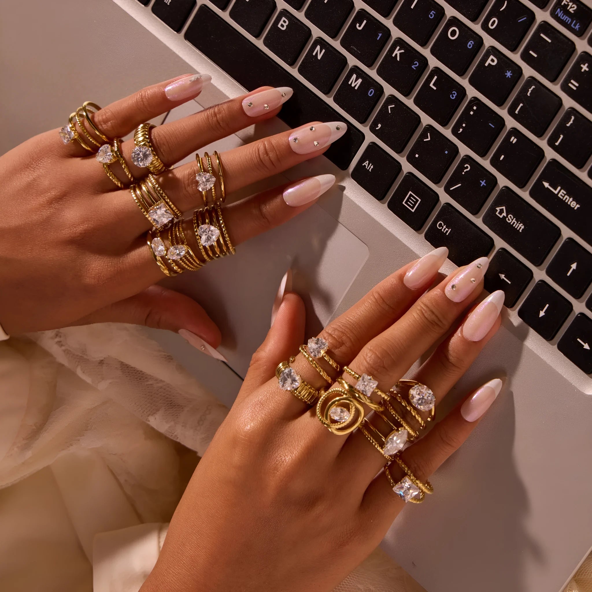 Gold electroplated stainless steel ring with zircon accents in open mouth geometry design