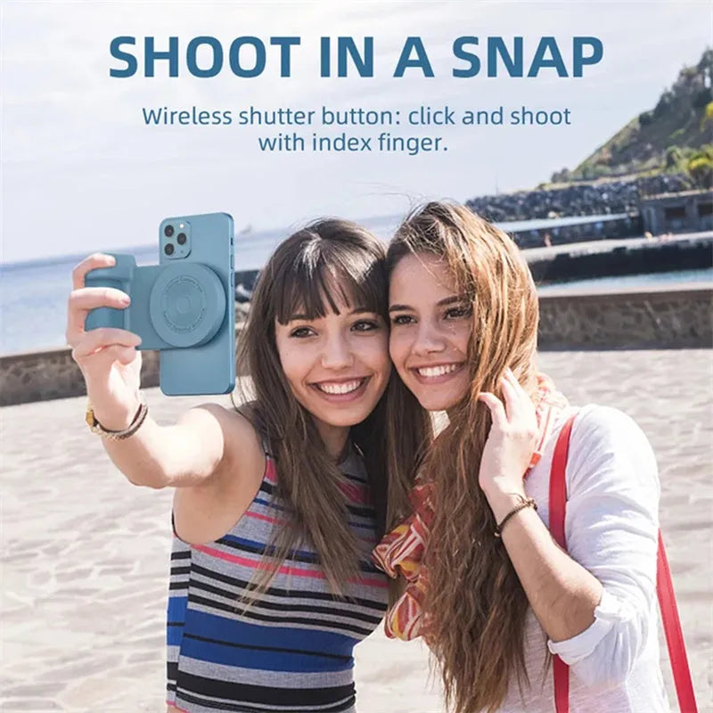 Black multifunctional phone camera holder with magnetic suction and rotatable stand on a table.