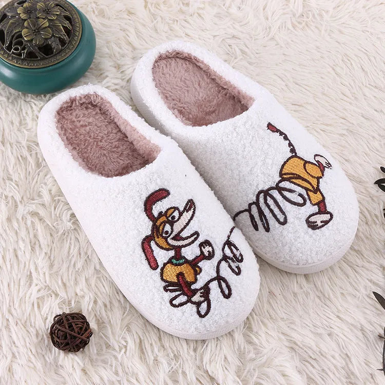 White fluffy slippers with cartoon pattern, rubber soles, and artificial wool lining