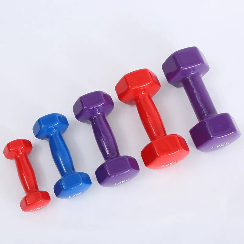Bright coloured plastic-coated fitness dumbbells for home exercise with floor protection