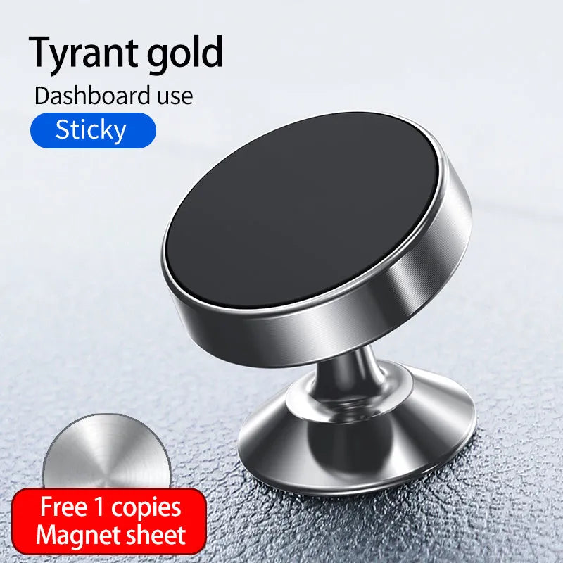 Black magnetic car phone holder mounted on a car dashboard, holding a smartphone